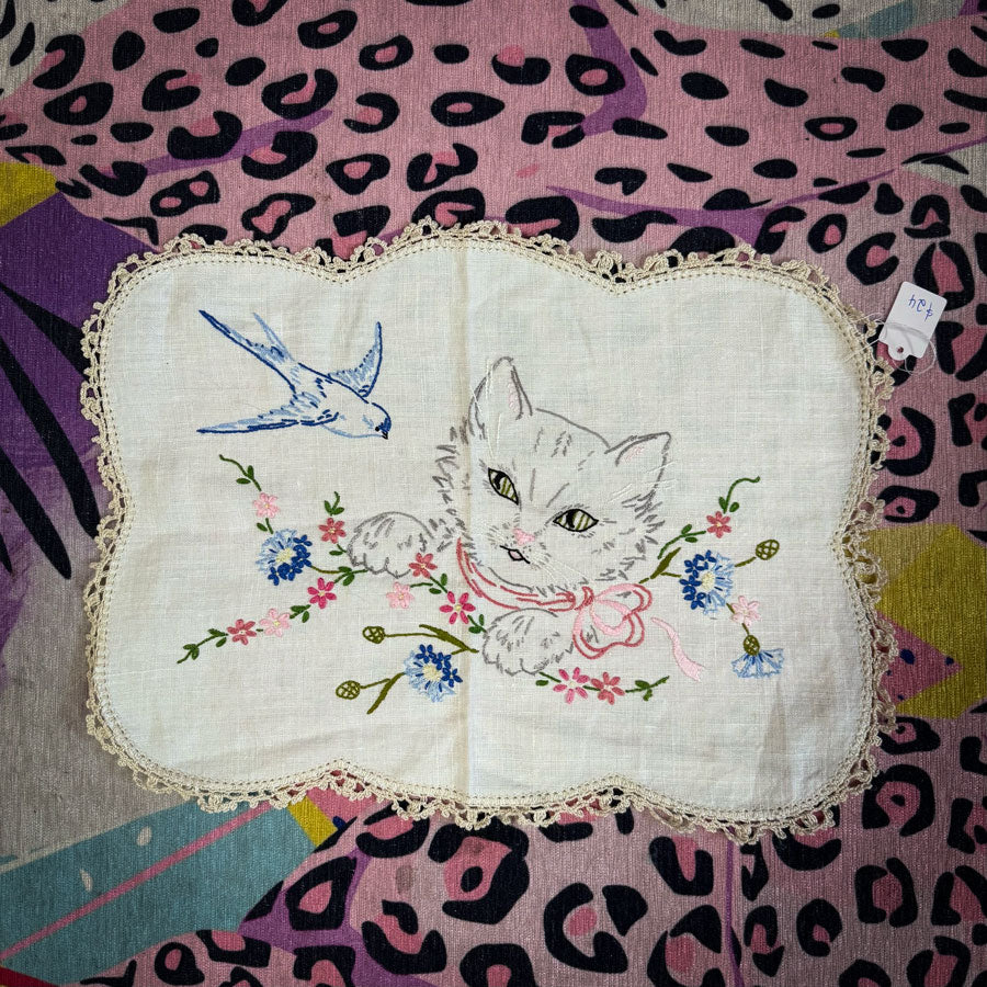 Cat and bird retro doilie