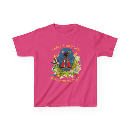 Pink t-shirt with a wombat graphic and text on a white background