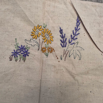 Unfinished embroidered apron