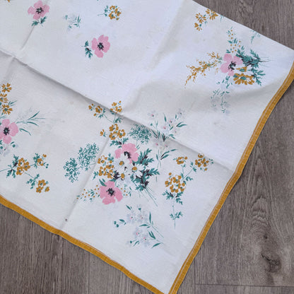 Yellow bordered floral tablecloth