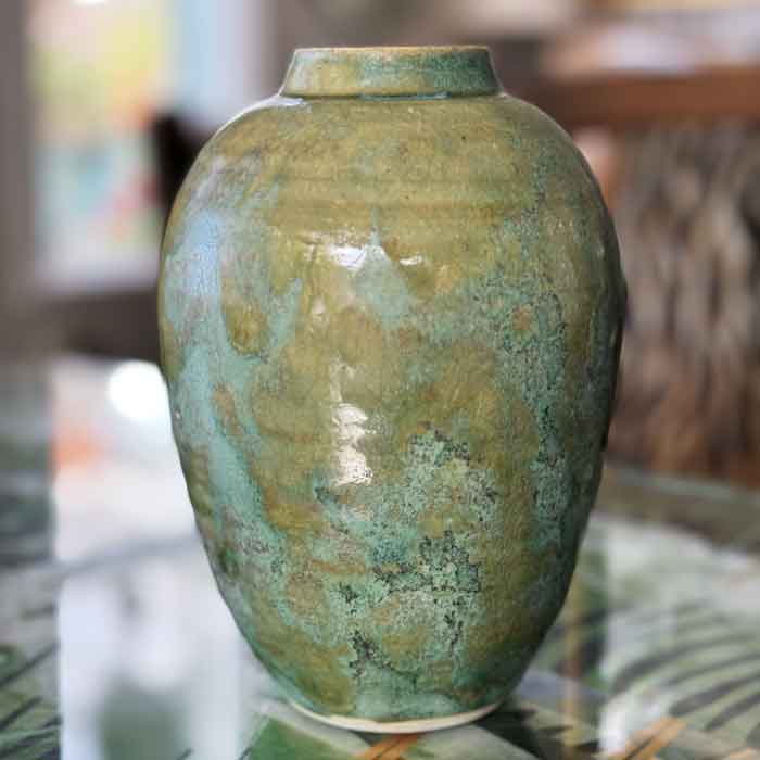 Signed green earthenware vase