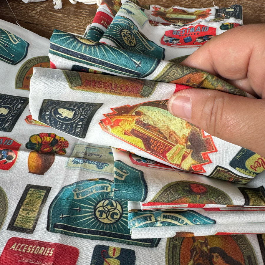 Old sewing needle label fabric