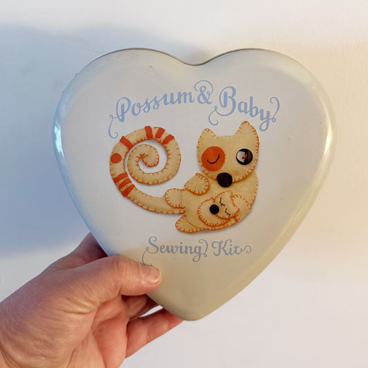 Possum and baby tin