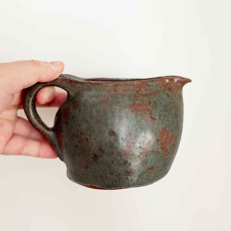 Green earthenware jug